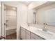 Clean and well-lit bathroom featuring a double vanity, mirror, and walk in shower, providing a modern and functional space at 112 Dorian Pl, Troutman, NC 28166