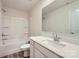 Bathroom featuring a tub, vanity with quartz counters, and wood-look tile flooring at 123 Dorian Pl, Troutman, NC 28166