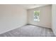 Bedroom with carpet flooring and natural light from a window at 123 Dorian Pl, Troutman, NC 28166