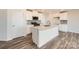 Modern kitchen with white cabinets, stainless steel appliances, and a center island at 123 Dorian Pl, Troutman, NC 28166