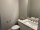Neutral half bath featuring a toilet and single vanity with attractive quartz countertop at 1117 Shadowmoss Ct, Salisbury, NC 28147