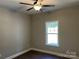 Bedroom featuring a fan, neutral paint, and a bright window at 1117 Shadowmoss Ct, Salisbury, NC 28147