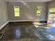 Spacious garage with concrete floors, brick trim, and bright windows at 1117 Shadowmoss Ct, Salisbury, NC 28147