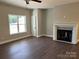 Living room featuring a fan, fireplace, and window at 1117 Shadowmoss Ct, Salisbury, NC 28147
