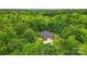 An aerial view of a brick home surrounded by lush green trees and landscaping at 1567 Fayrene Rd, Rock Hill, SC 29732