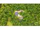 Overhead view of a home surrounded by dense trees, a long driveway, lush forestry and an outbuilding at 1567 Fayrene Rd, Rock Hill, SC 29732
