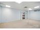 Unfinished basement with neutral carpet, white walls and french doors at 1567 Fayrene Rd, Rock Hill, SC 29732
