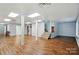 Large basement area with laminate flooring, stairway, and support columns at 1567 Fayrene Rd, Rock Hill, SC 29732