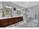 Elegant bathroom with double vanity, framed mirrors, and a separate bathtub at 1567 Fayrene Rd, Rock Hill, SC 29732