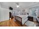 Inviting bedroom with a wooden bed frame, hardwood floors, and ample natural light at 1567 Fayrene Rd, Rock Hill, SC 29732