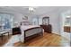 Comfortable bedroom with hardwood floors, ceiling fan, and natural light from the window at 1567 Fayrene Rd, Rock Hill, SC 29732