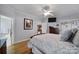 Serene bedroom featuring hardwood floors, neutral colors, and access to the ensuite bathroom at 1567 Fayrene Rd, Rock Hill, SC 29732