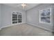 Neutral bedroom with carpet, ceiling fan, and a large window that lets in light at 1567 Fayrene Rd, Rock Hill, SC 29732