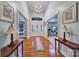 Grand foyer featuring hardwood floors, chandelier, and elegant doorway accents with natural light at 1567 Fayrene Rd, Rock Hill, SC 29732