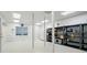 Spacious garage with built in shelving, white walls and tile flooring at 1567 Fayrene Rd, Rock Hill, SC 29732