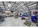 Huge garage with high ceilings, white trusses, and cabinets for workshop and cars at 1567 Fayrene Rd, Rock Hill, SC 29732