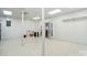 Large garage space with built in shelves, white walls and light tile flooring at 1567 Fayrene Rd, Rock Hill, SC 29732