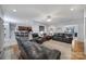 Open living room with leather furniture, hardwood floors, and seamless flow to the kitchen at 1567 Fayrene Rd, Rock Hill, SC 29732