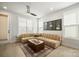 Light and airy living room featuring a large beige sectional sofa and a wooden coffee table at 1925 Dunavant St, Charlotte, NC 28203