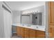 Well-lit bathroom with double sinks, a large mirror, and plenty of cabinet space for storage at 211 Heritage Blvd # 502, Fort Mill, SC 29715