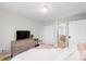 Well-lit bedroom with wooden floors, closet, and updated furniture, creating a cozy retreat at 211 Heritage Blvd # 502, Fort Mill, SC 29715