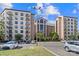 View of a multi-story building with balconies and many windows with a parking lot in front at 211 Heritage Blvd # 502, Fort Mill, SC 29715