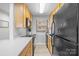 Contemporary kitchen featuring sleek black appliances, lots of counter space and wood cabinets at 211 Heritage Blvd # 502, Fort Mill, SC 29715