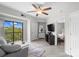 Bright living room featuring wood floors, neutral decor, access to a balcony and bedroom at 211 Heritage Blvd # 502, Fort Mill, SC 29715