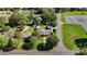 Aerial view of the property with a well-maintained lawn, detached garage, above ground pool, and convenient road access at 114 34Th Nw St, Hickory, NC 28601