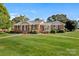 Charming brick home featuring a well-manicured lawn and inviting entrance at 114 34Th Nw St, Hickory, NC 28601