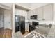 Modern kitchen with granite countertops and black appliances at 115 E Park Ave # 419, Charlotte, NC 28203