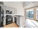 Modern kitchen with granite countertops and black appliances at 115 E Park Ave # 419, Charlotte, NC 28203