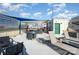Shared rooftop deck with lounge chairs, tables, and city views at 115 E Park Ave # 419, Charlotte, NC 28203