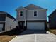 Charming two-story home featuring stone accents, a two-car garage, and a well-maintained front yard at 1276 31St Ne St, Conover, NC 28613