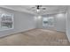 Bedroom featuring a tray ceiling and two large windows at 500 Pearl Place Ln, York, SC 29745