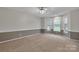 Spacious bedroom featuring neutral walls, carpet, and a bay window at 500 Pearl Place Ln, York, SC 29745