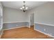Well-lit dining room featuring hardwood floors and elegant chandelier at 500 Pearl Place Ln, York, SC 29745
