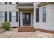 Close-up of the elegant front door, featuring sidelights and brick steps at 500 Pearl Place Ln, York, SC 29745