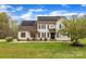 Inviting two-story home featuring solar panels and a beautifully landscaped front yard at 500 Pearl Place Ln, York, SC 29745