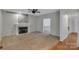Spacious living room with a fireplace, carpet, and a barn door accent at 500 Pearl Place Ln, York, SC 29745