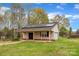 Charming outbuilding with solar panels, a covered porch, and ample space for storage or hobbies at 500 Pearl Place Ln, York, SC 29745
