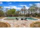 Beautiful swimming pool with a stone patio, a relaxing spa, and comfortable chaise lounges at 500 Pearl Place Ln, York, SC 29745