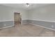 Bonus room with wainscoting and neutral carpeting at 500 Pearl Place Ln, York, SC 29745