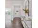 Elegant entryway boasts hardwood floors, decorative molding, and a stylish console table with mirror at 5096 Silver Creek Ln, Denver, NC 28037