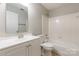 Clean bathroom featuring a shower-tub combo, modern vanity, and updated toilet at 5832 Amity Springs Dr, Charlotte, NC 28212