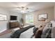 Serene bedroom with a ceiling fan, a large window, and modern decor for a relaxing retreat at 5832 Amity Springs Dr, Charlotte, NC 28212