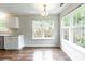 Bright dining room with modern light fixture and large windows at 5832 Amity Springs Dr, Charlotte, NC 28212