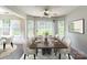 Elegant dining room with large windows overlooking the backyard and a spacious table for entertaining at 5832 Amity Springs Dr, Charlotte, NC 28212