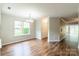 Bright and airy living room with hardwood floors and large windows at 5832 Amity Springs Dr, Charlotte, NC 28212
