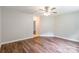 This is a well-lit living room featuring laminate flooring and neutral paint at 5832 Amity Springs Dr, Charlotte, NC 28212